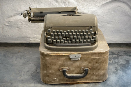An old typewriter on an old suitcase