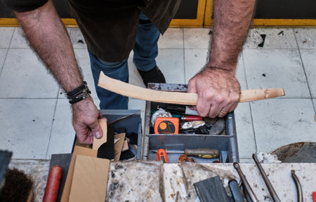 A shoemaker working in a workshop