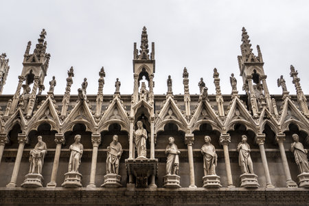 A beautiful view of the Santa Maria Della Spina church side wall with carvings and sculptures in Pisa, Italyの写真素材