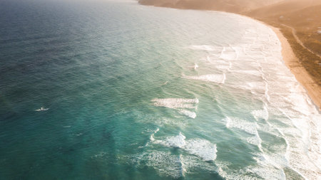 StunAerial View of Waves and Beaches at Sunset Along the Great Ocean Road, Australiaの写真素材