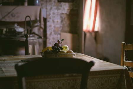 A selective focus shot of ripe fruits on a plate on the kitchen tableの写真素材