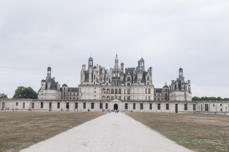 A stunning view of the Chateau de Chambord castle under a cloudy sky at Loire Valley, Franceの写真素材