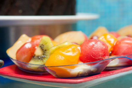 A closeup shot of peeled fruits in a glass bowlの写真素材