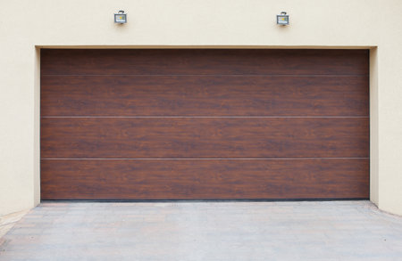 A closeup shot of brown sectional garage doorsの写真素材