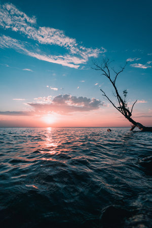 A beautiful view of the breathtaking sunset over the seaの写真素材