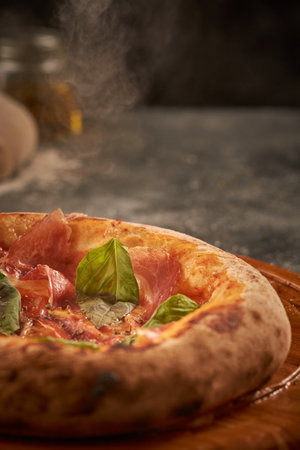 A vertical shot of a delicious prosciutto pizzaの写真素材