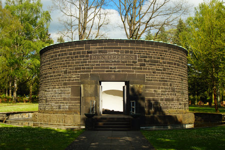 War Victims' Memorial at Frankfurt Main Cemetery in memory of those who died in both World Wars. Surrounded by war graves of the I. and II. World War.の写真素材
