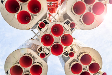 A low angle of the powerful space rocket engines under the cloudy skyの写真素材