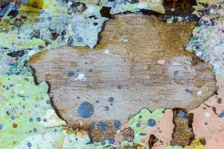 A top view of old dried paint on a tree log with creative copy space in the middleの写真素材
