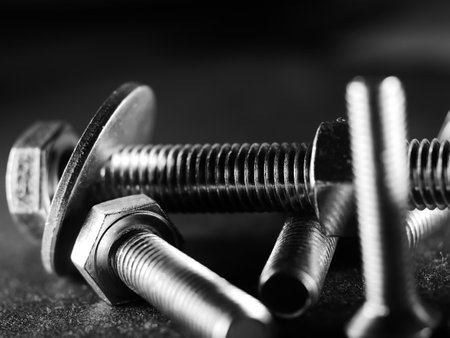 a closeup shot of metal screw threads isolated on the black background
