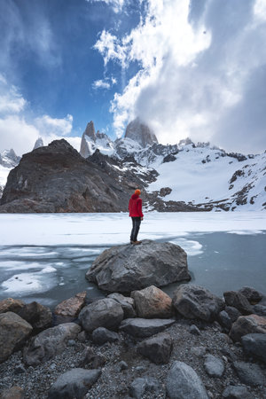 A male on Laguna de Los Tres with Mt Fitz Roy in the background
