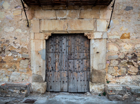 A closeup shot of an aged door in the ancient village Pedraza, Spainの写真素材