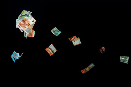 Falling money fon black backgroundの写真素材