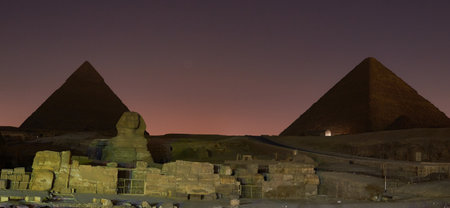 A panoramic shot of Giza Necropolis in Egypt with beautiful sunset background