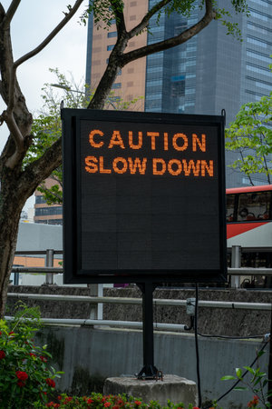 Caution Slowdown. Traffic information sign. Vertical shot