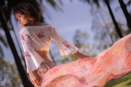 Solo Caucasian female traveler alone amidst Palm Trees in Putrajaya, Malaysiaの写真素材
