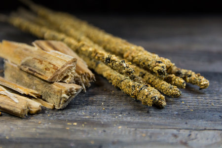close-up of handmade incense and natural ingredients on wooden backgroundの写真素材