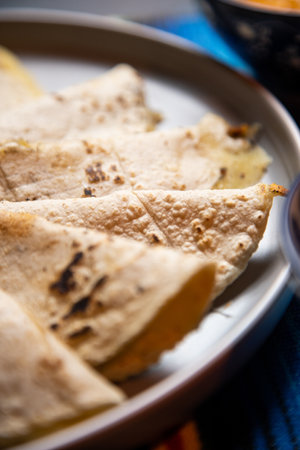 A vertical shot of tortillas on a plate