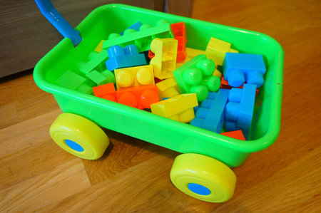 Plastic cart full of plastic toy blocks
