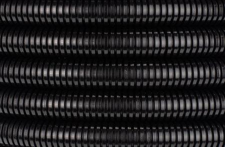 Roll of plastic corrugated pipe for electrical installation close-up. BACKGROUNDの写真素材