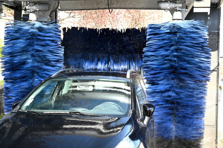 Blue brushes cleaning the carの写真素材