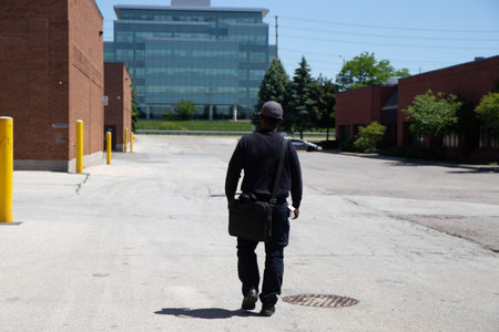 A rear view of a security guard protecting property from illegal parking and theft.
