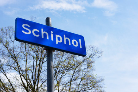 The sign showing the border of Schiohol on a blue sky backgroundの写真素材