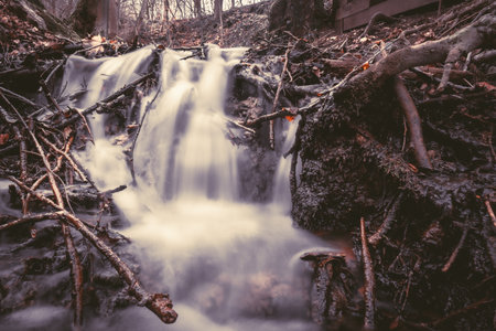 Sinter terraces waterfall in Leutenbach the Franconian Switzerland. Long exposure at the river.