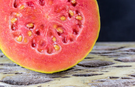 A closeup shot of a cut red guavaの写真素材