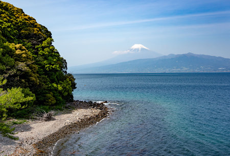 An aerial shot of a scenic coast with the majestic Mount Fuji in the backgrouの写真素材