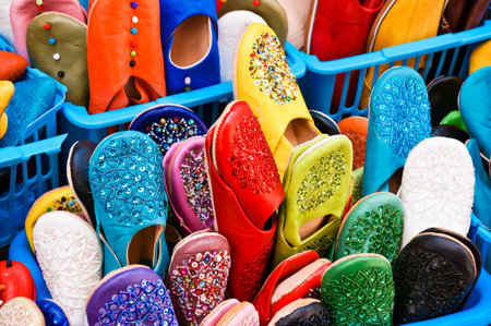 A selective focus shot of Moroccan slippers in a marketの写真素材