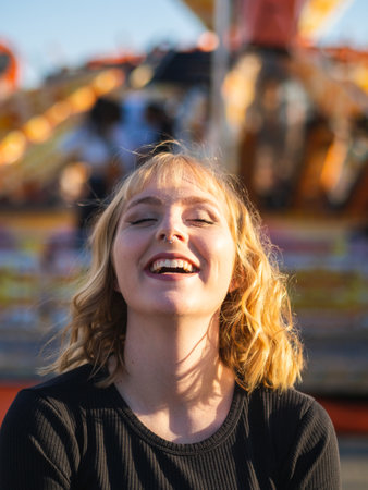 A happy blonde Spanish woman in the amusement park