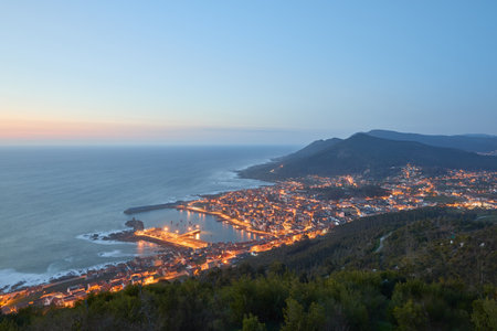 An aerial view of the city of La Guardia in Galicia, Spain at sunsetの写真素材