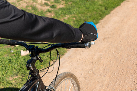 A closeup shot of a man doing a mountain bike route