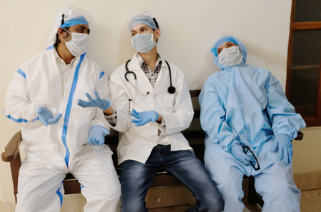 A group of exhausted medical personnel during the COVID-19 pandemic