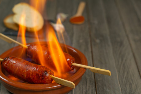 spicy chorizo to hell cooked over a fire right on the tableの写真素材