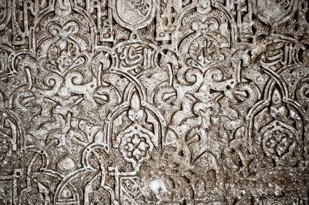 A closeup shot of a carved wall of the Alhambra palace in Granada, Spainの写真素材