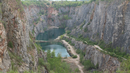 A beautiful view to the large flooded quarry with the turquoise water near Prague, Czech republic