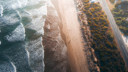 StunAerial View of Waves and Beaches at Sunset Along the Great Ocean Road, Australiaの写真素材