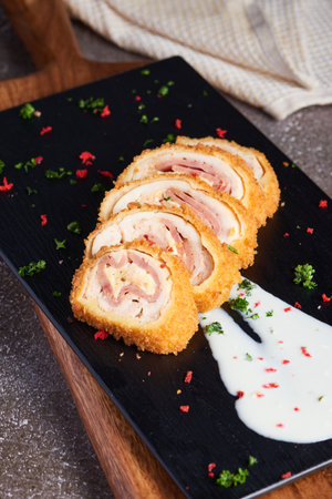 A vertical shot of delicious decorated rolls on a wooden boardの写真素材