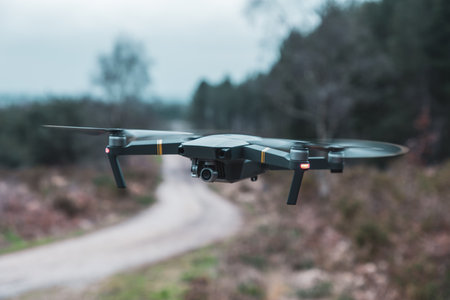 A closeup shot of a modern black drone in flightの写真素材