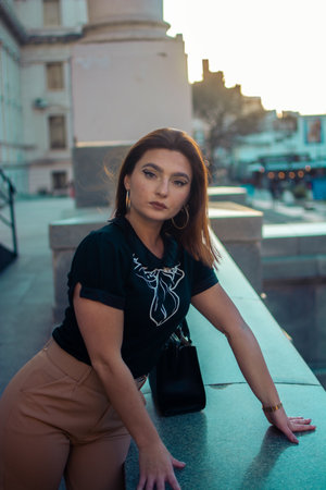 A closeup shot of a caucasian female with beautiful clothes posing outdoors