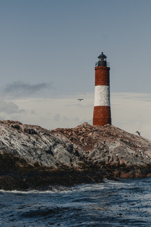 A vertical shot of a lighthouse on a cloudy dayの写真素材
