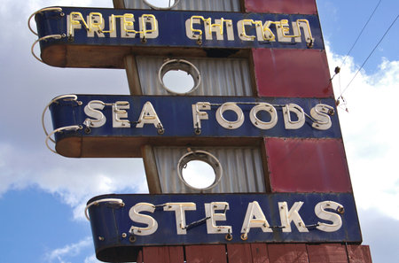 Restaurant Sign on Building Roofの写真素材