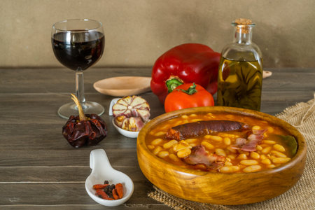 baked beans with garnish in different wood-bottomed containersの写真素材