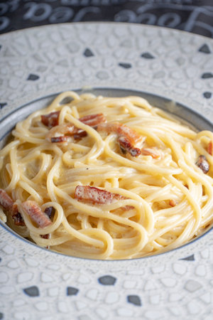 Close up of plate of spaghetti carbonaraの写真素材
