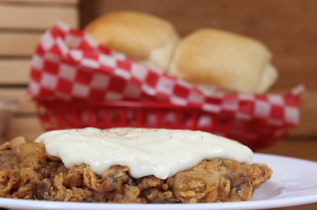 Chicken Fried Steak and Gravy With Mashed Potatoes in Rural Cafeの写真素材