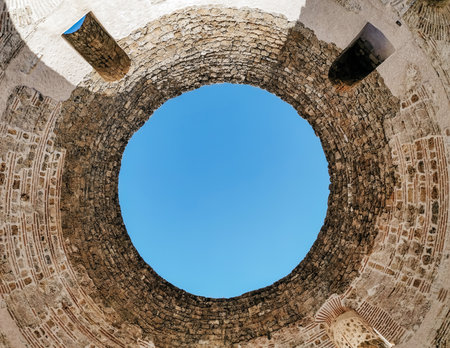 Directly below view of open circular roof of an ancient building inside Diocletian's palace in Split, Croatia.の写真素材