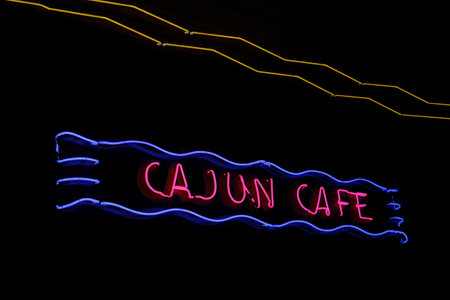Vintage Neon Cajun Cafe Sign on Restaurant Wallの写真素材