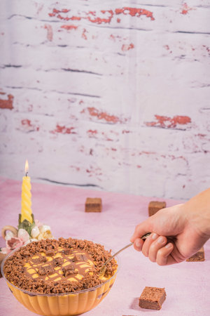 Serving to taste a delicious lucuma mousse with chocolate brownies.の写真素材